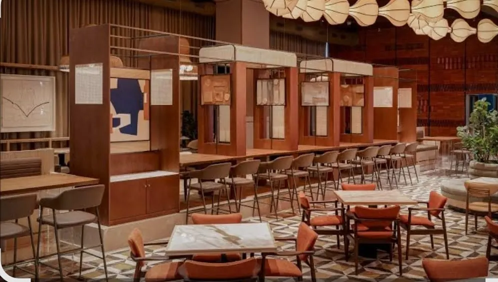 The THE TANDOOR EXPRESS dining room with counter seating and warm lighting